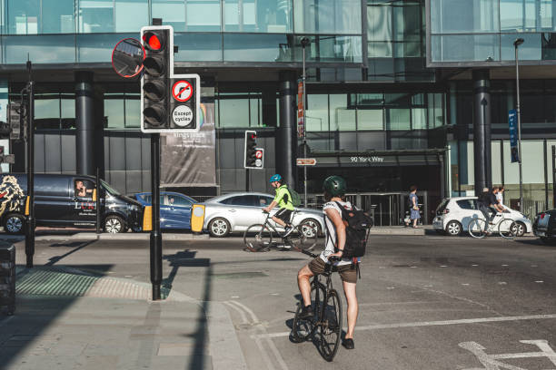 Cyclist waiting at a signalised crossing on a Skien side street