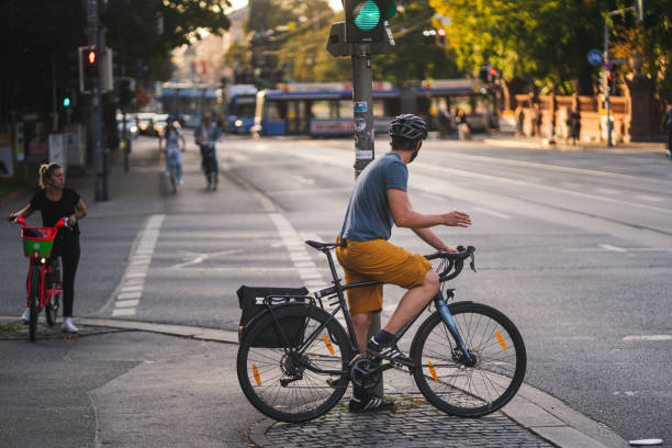 Cyclist waiting at traffic lights on a Skien intersection